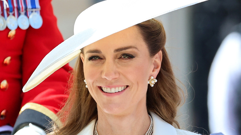 Kate Middleton smiling in white hat