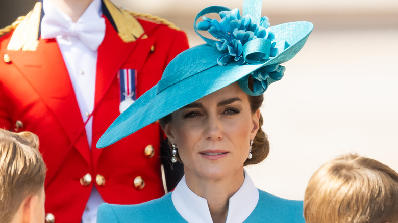 Kate Middleton wears an aqua blue hat