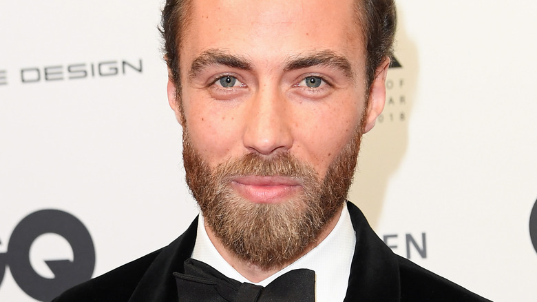 James Middleton with slight smile on red carpet