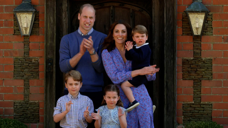 Prince Willian, Kate Middleton, George, Charlotte and Louis clapping
