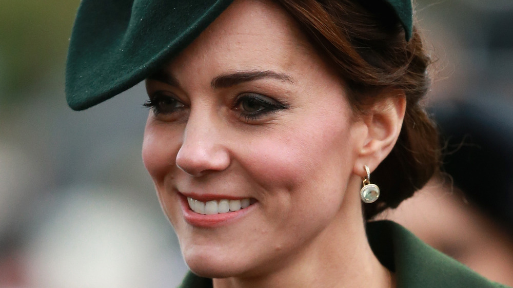 Kate Middleton smiling in green