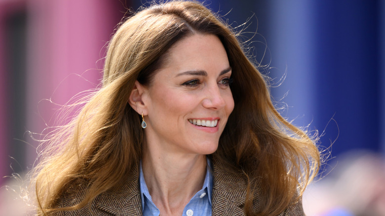 Kate Middleton looking to the side and smiling