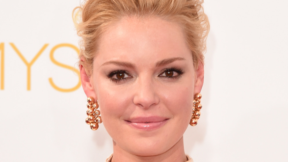 Katherine Heigl smiles for a photo on the red carpet