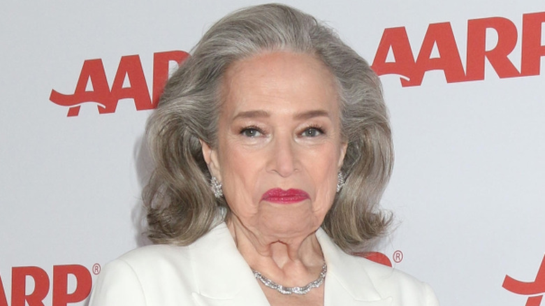 Kathy Bates frowning on the red carpet