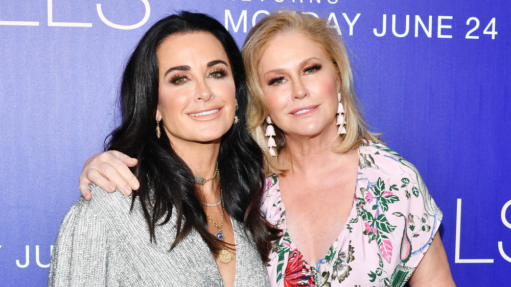 Kyle Richards and Kathy Hilton, smiling while posing arm in arm