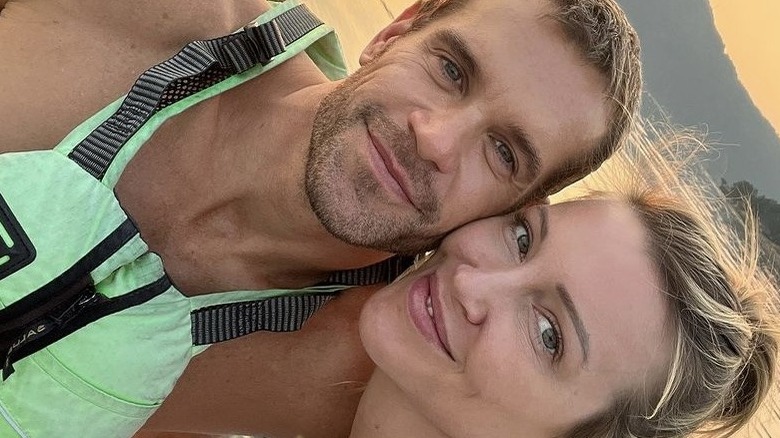 Stephen Huszar and Katie Cassidy smile for a selfie