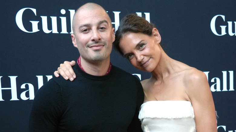 Katie Holmes posing with beau Jason Bard Yarmosky at an event