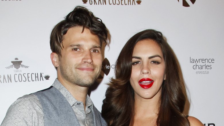 Tom schwartz and Katie Maloney Schwartz smiling on red carpet