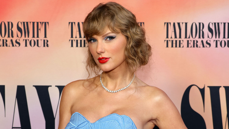 Taylor Swift wearing a blue dress