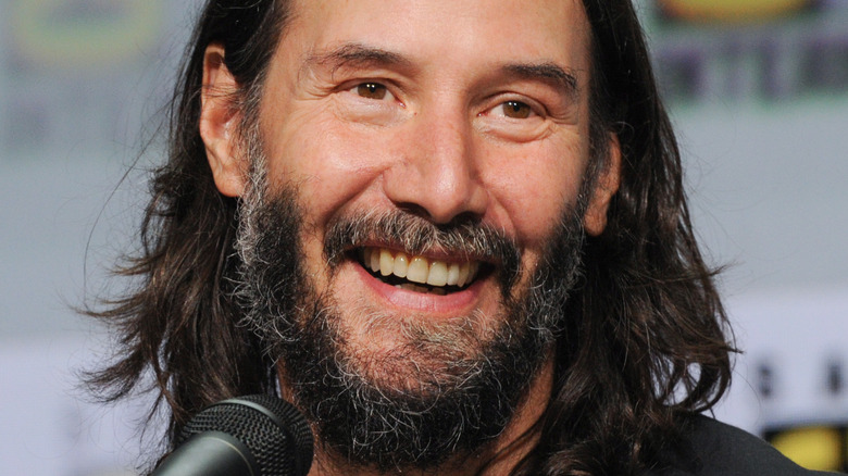 Keanu Reeves with a big smile