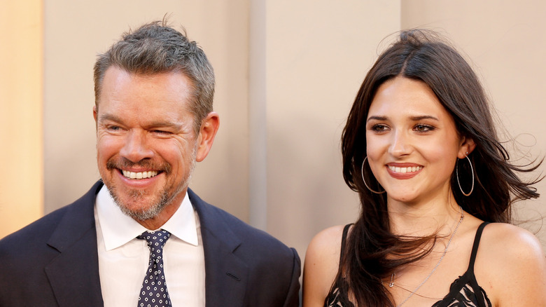 Matt Damon and daughter Isabella smiling while posing at an event together