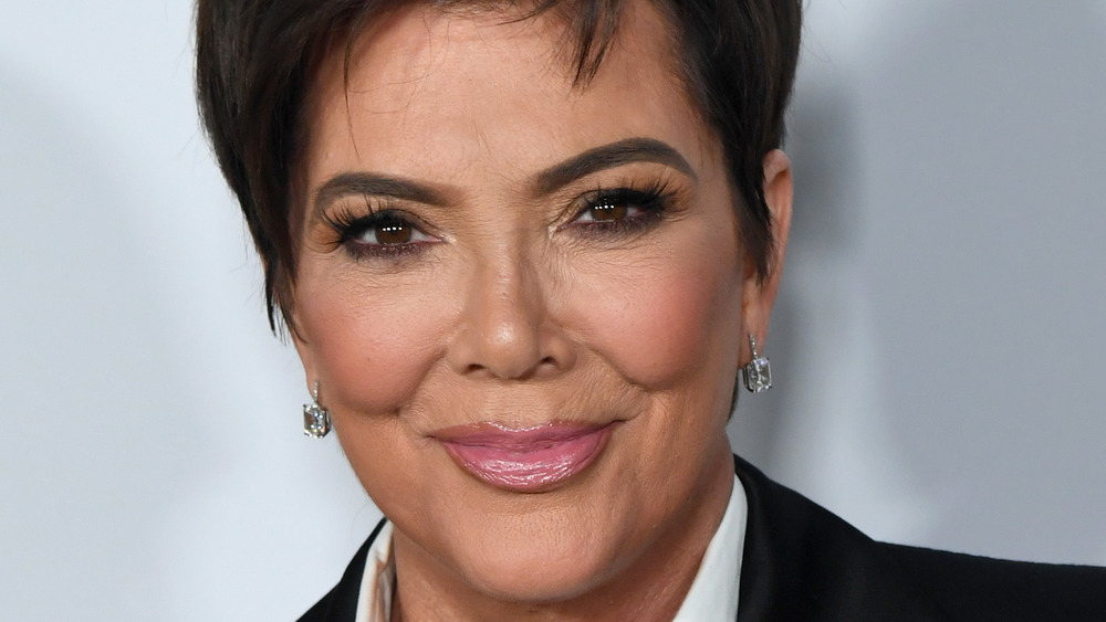 Kris Jenner smiling for the cameras at an event