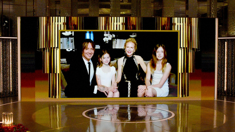 Keith Urban, Nicole Kidman, and daughters seated on couch