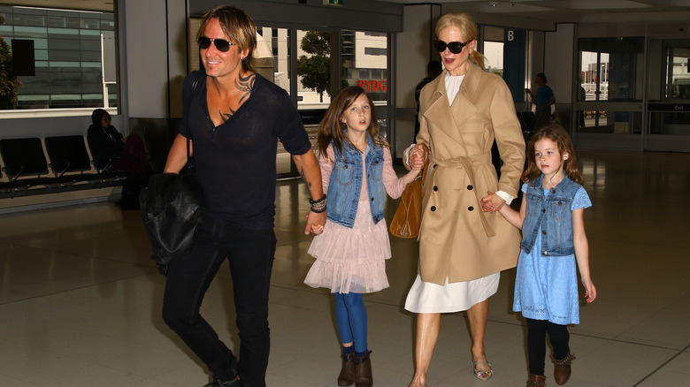 Nicole Kidman, Keith Urban, holding hands with daughters