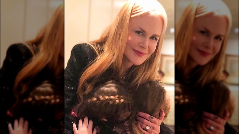 Nicole Kidman hugging daughters