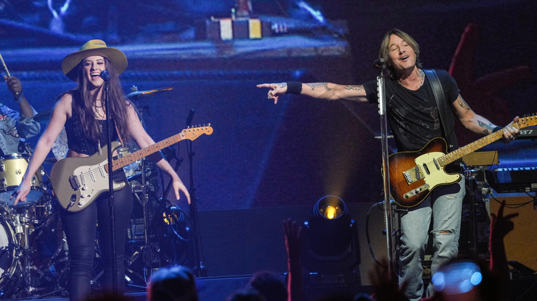 Maggie Baugh and Keith Urban on stage