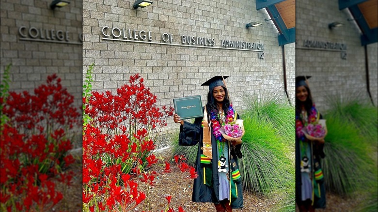 Allure Mitchell posing with diploma