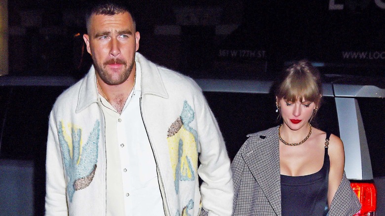 Travis Kelce walking with Taylor Swift