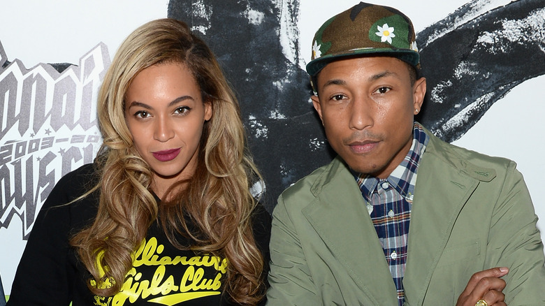 Beyonce and Pharrell gazing in front