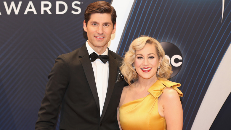 Ben Aaron and Kellie Pickler smile at red carpet event