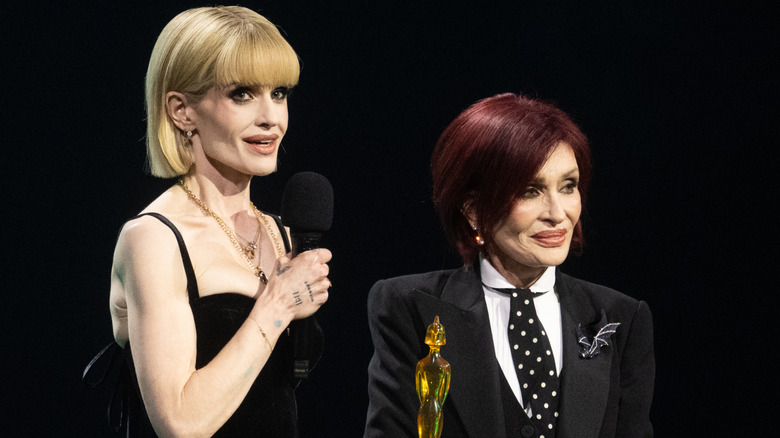 Kelly and Sharon Osbourne accepting Ozzy Osbourne's posthumous lifetime achievement award at the 2026 BRIT awards.