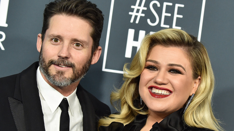 Kelly Clarkson and ex-husband Brandon Blackstock posing