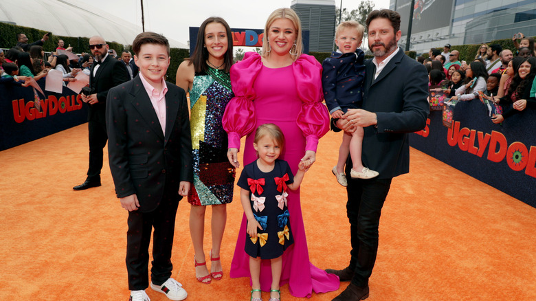 Kelly Clarkson smiling with Brandon Blackstock and their children