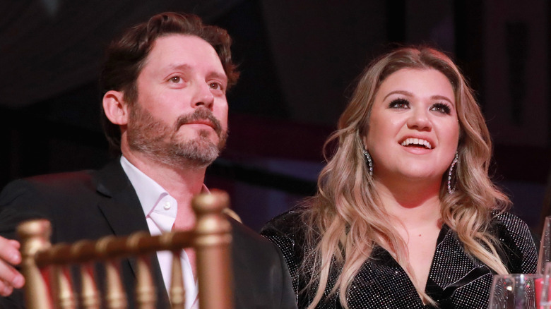 Brandon Blackstock and Kelly Clarkson attending Billboard's Women in Music 2017