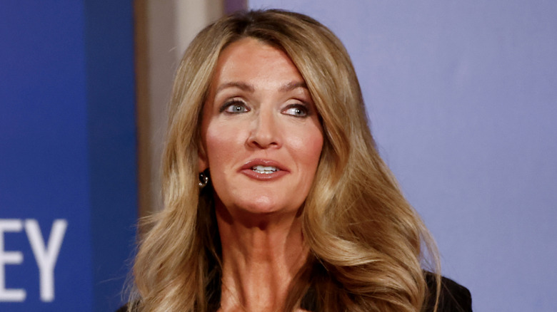 Kelly Loeffler speaking on stage at a forum.