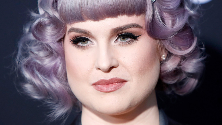 Kelly Osbourne smirking