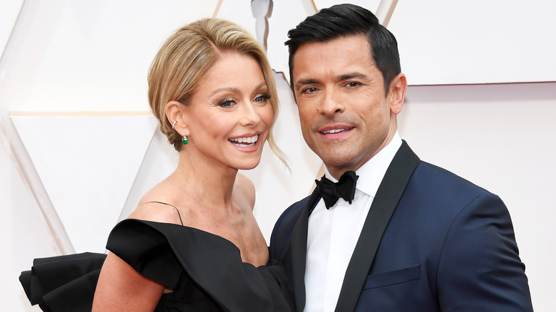 Kelly Ripa and Mark Consuelos posing