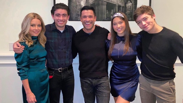 The Consuelos family posing