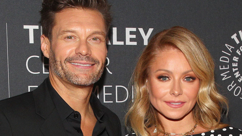 Ryan Seacrest and Kelly Ripa in black