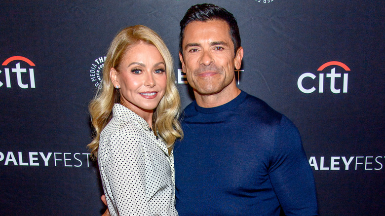 Kelly Ripa and Mark Consuelos pose in 2023
