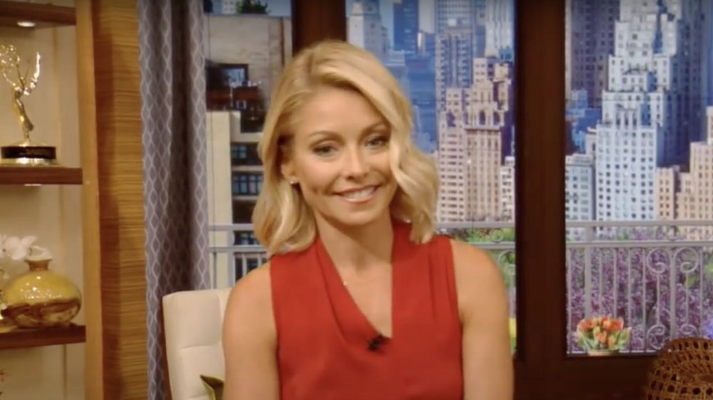 Kelly Ripa in a red sleeveless dress