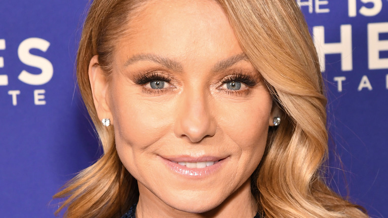 Kelly Ripa poses in a sequin gown
