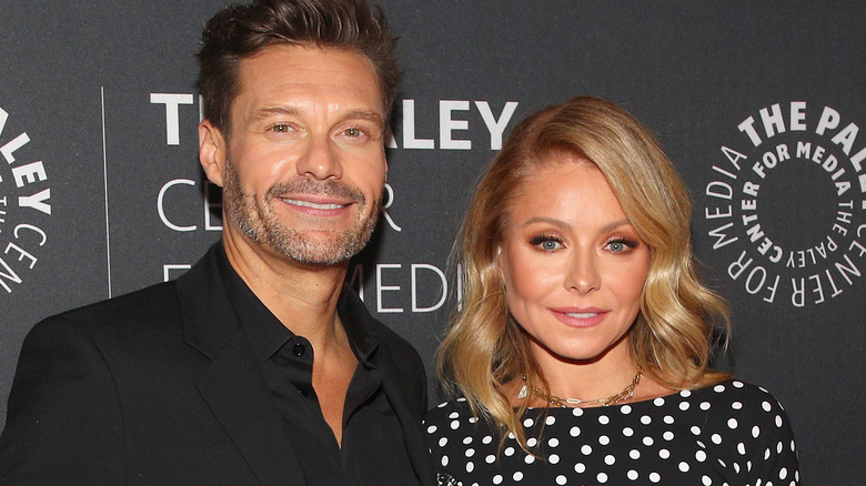 Kelly Ripa and Ryan Seacrest smiling