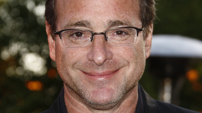 Bob Saget smiles for a photo outside