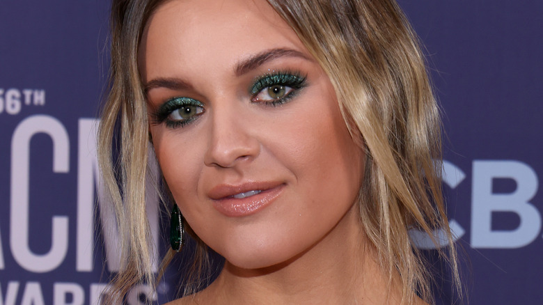 Kelsea Ballerini smiling with head tilted