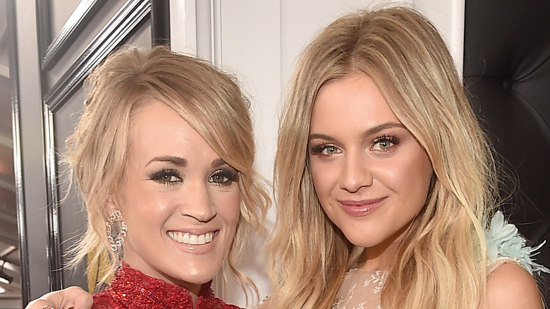 Carrie Underwood posing with Kelsea Ballerini