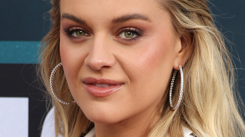 Kelsea Ballerini wearing large hoop earrings