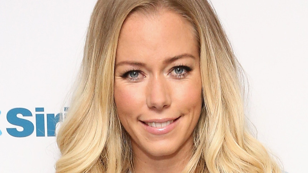 Kendra Wilkinson smiling at an event 