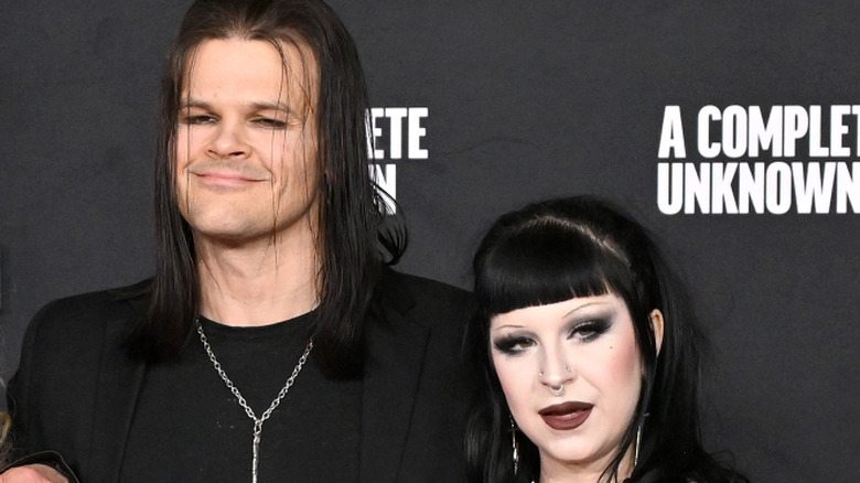 Angelina Sambrotto and Travis Bacon at premiere of A Complete Unknown
