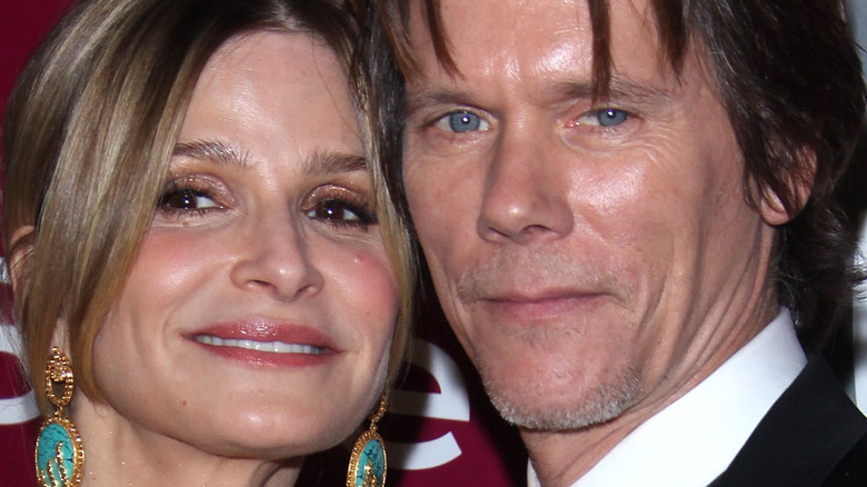 Kyra Sedgwick and Kevin Bacon pose on the red carpet