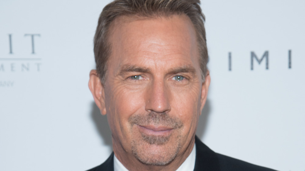 Kevin Costner smiling on the red carpet