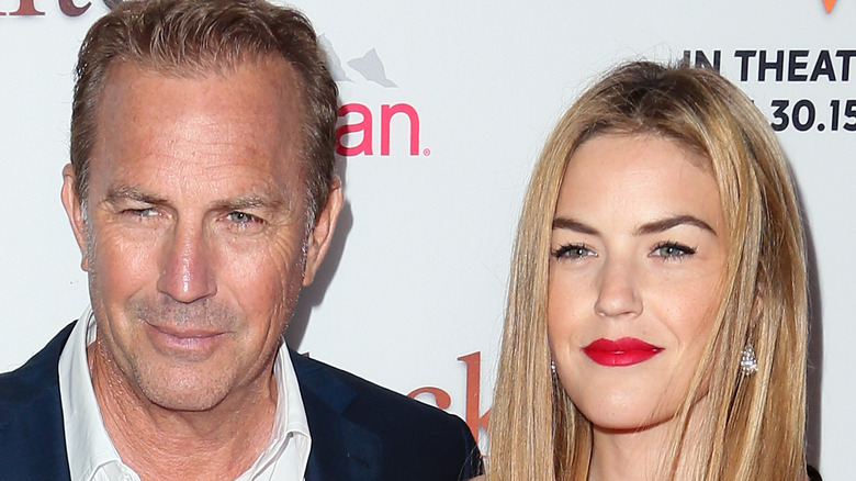 Lily Costner and her dad Kevin Costner posing for cameras 