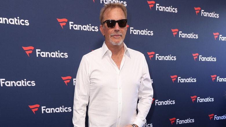 Kevin Costner wearing shades