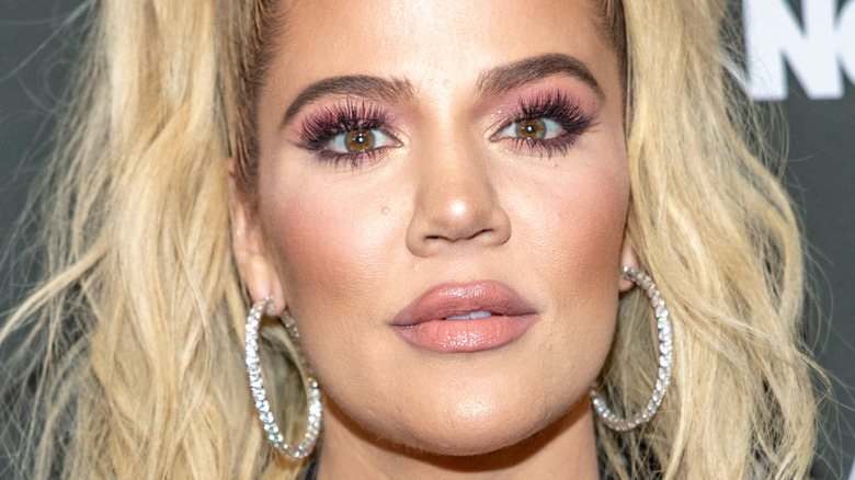 Khloe Kardashian blonde hair diamond hoop earrings