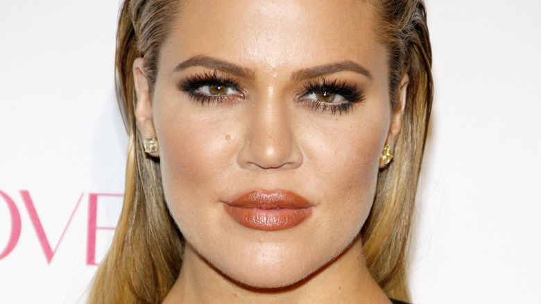 Khloé Kardashian with her hair slicked back