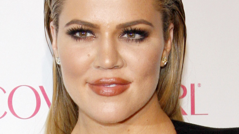 Khloe Kardashian posing at an event 